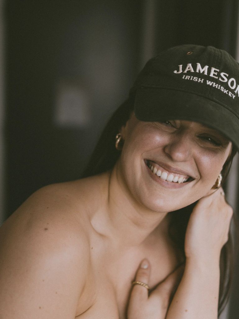 Woman smiling with cap