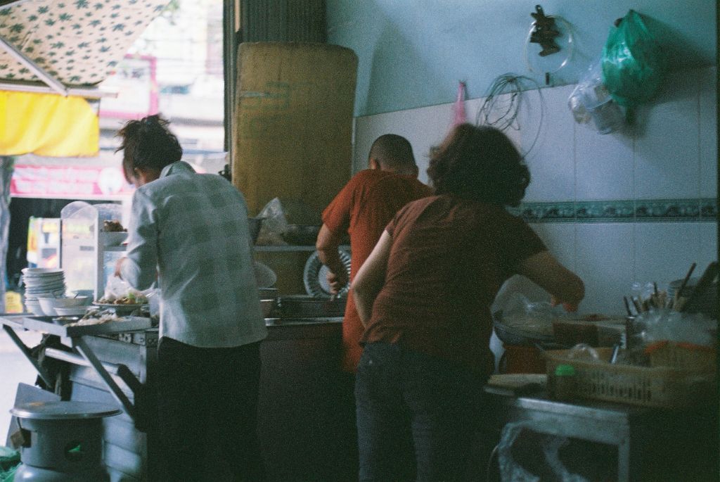 People cooking in a kitchen setting