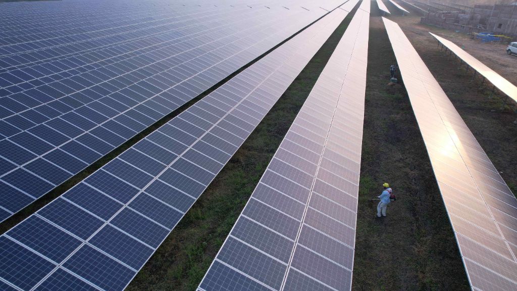 Solar power plant with technician